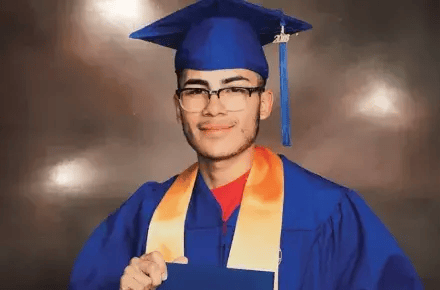 Matthew wear graduation cap and gown.