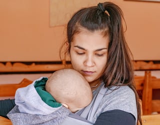 young-mother-holding-her-baby-2025-02-13-04-13-42-utc